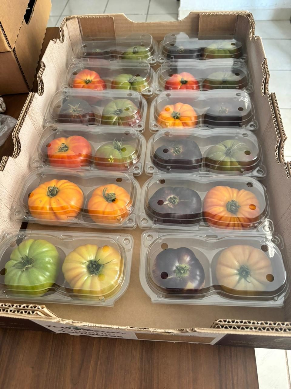 Case of heirloom tomatoes in two-count clamshells